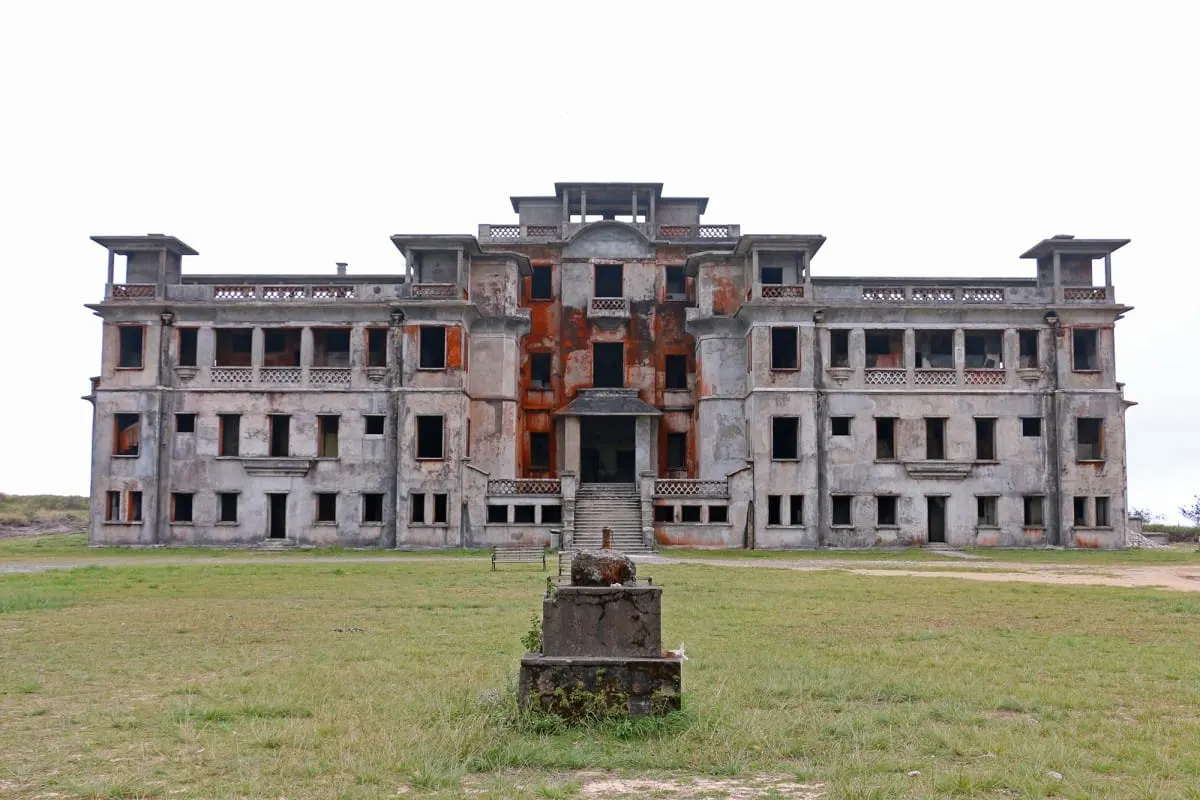 Weathered facade of the abandoned French Bokor Palace Hotel, Bokor Hill Station.