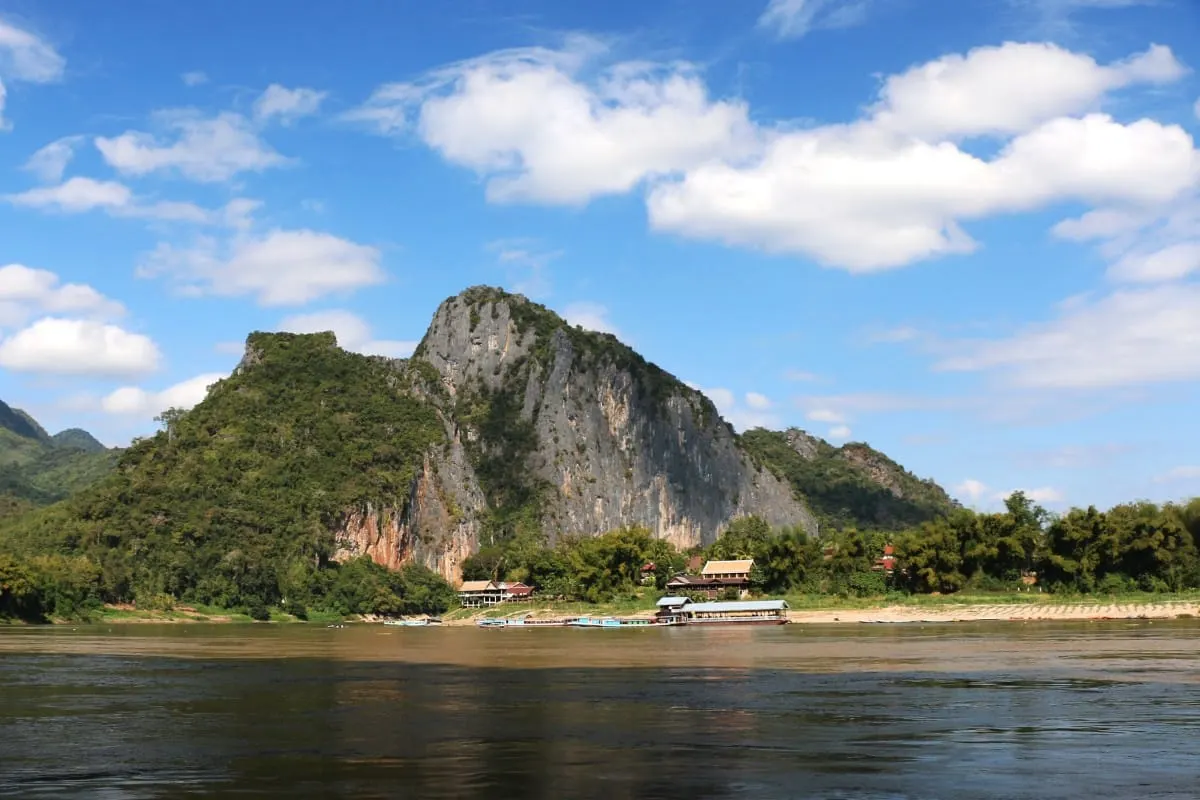 Limestone karst mountain rising above the Mekong near the Pak Ou Caves