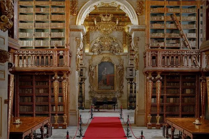 Gilded Baroque interior of the Biblioteca Joanina at the University of Coimbra