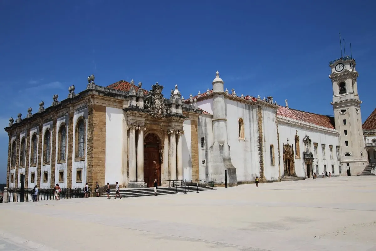 University of Coimbra courtyard with the Joanina Library facade and clock tower
