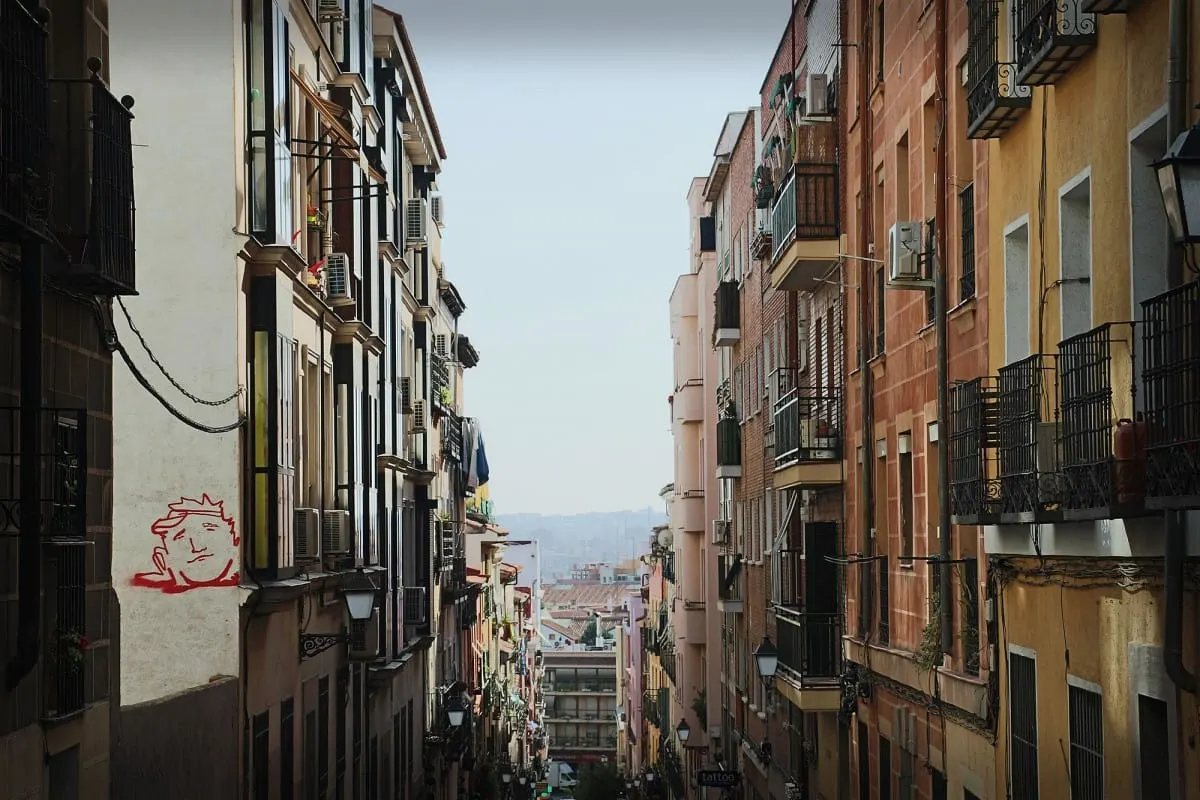 Narrow Lavapies street of balconied apartment buildings, Madrid