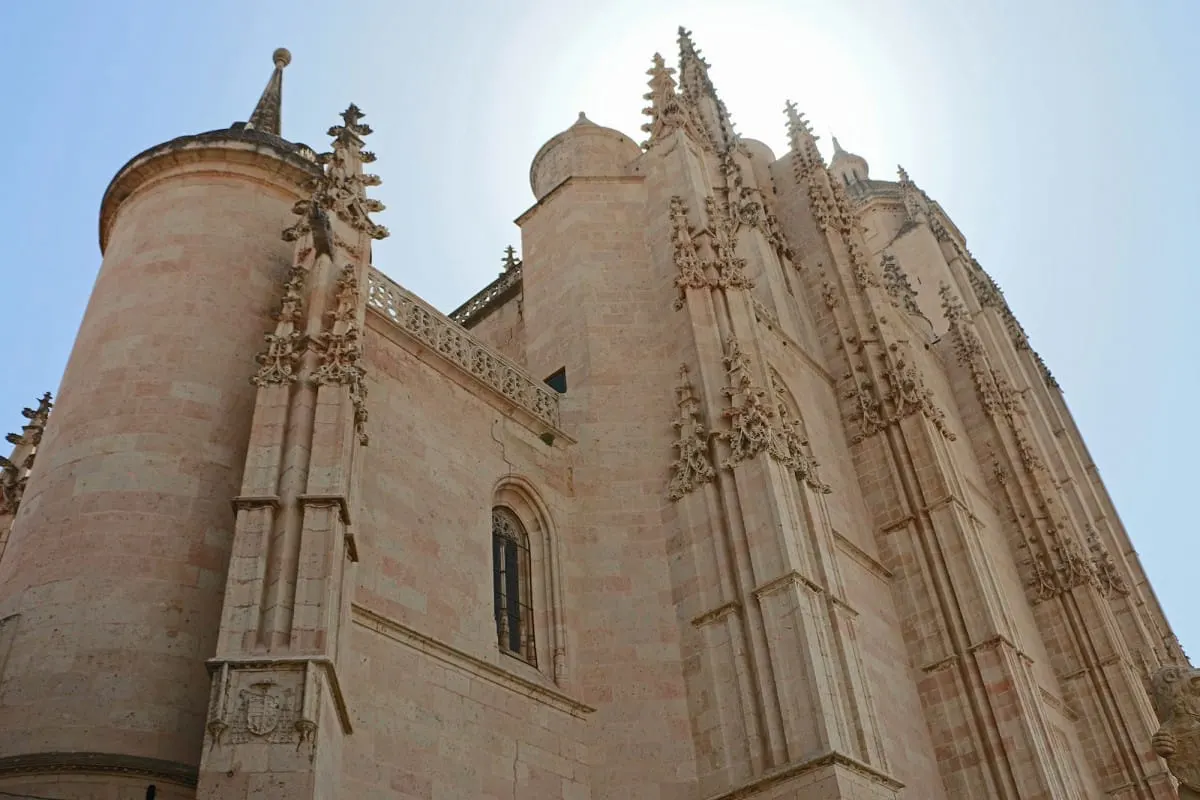 Looking up at the carved Gothic stone walls of Segovia Cathedral