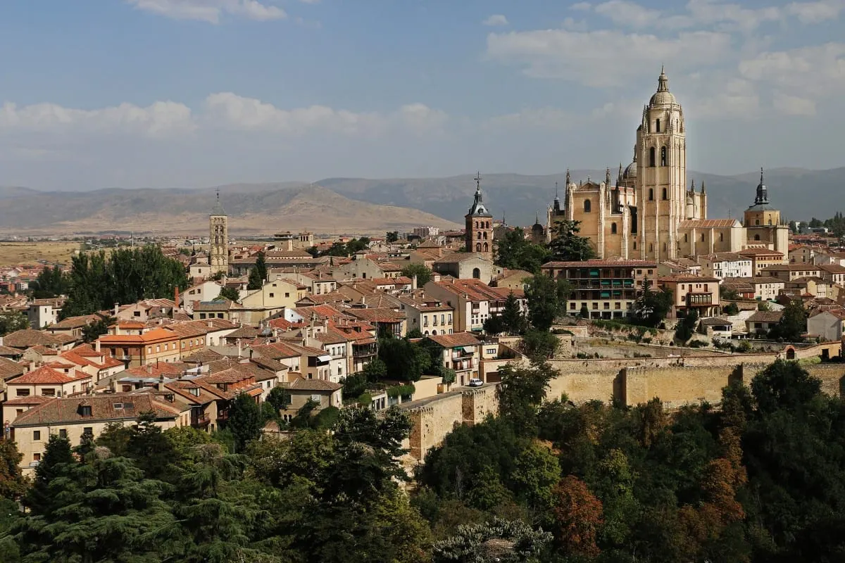 Rooftops of Segovia with the cathedral and distant mountains