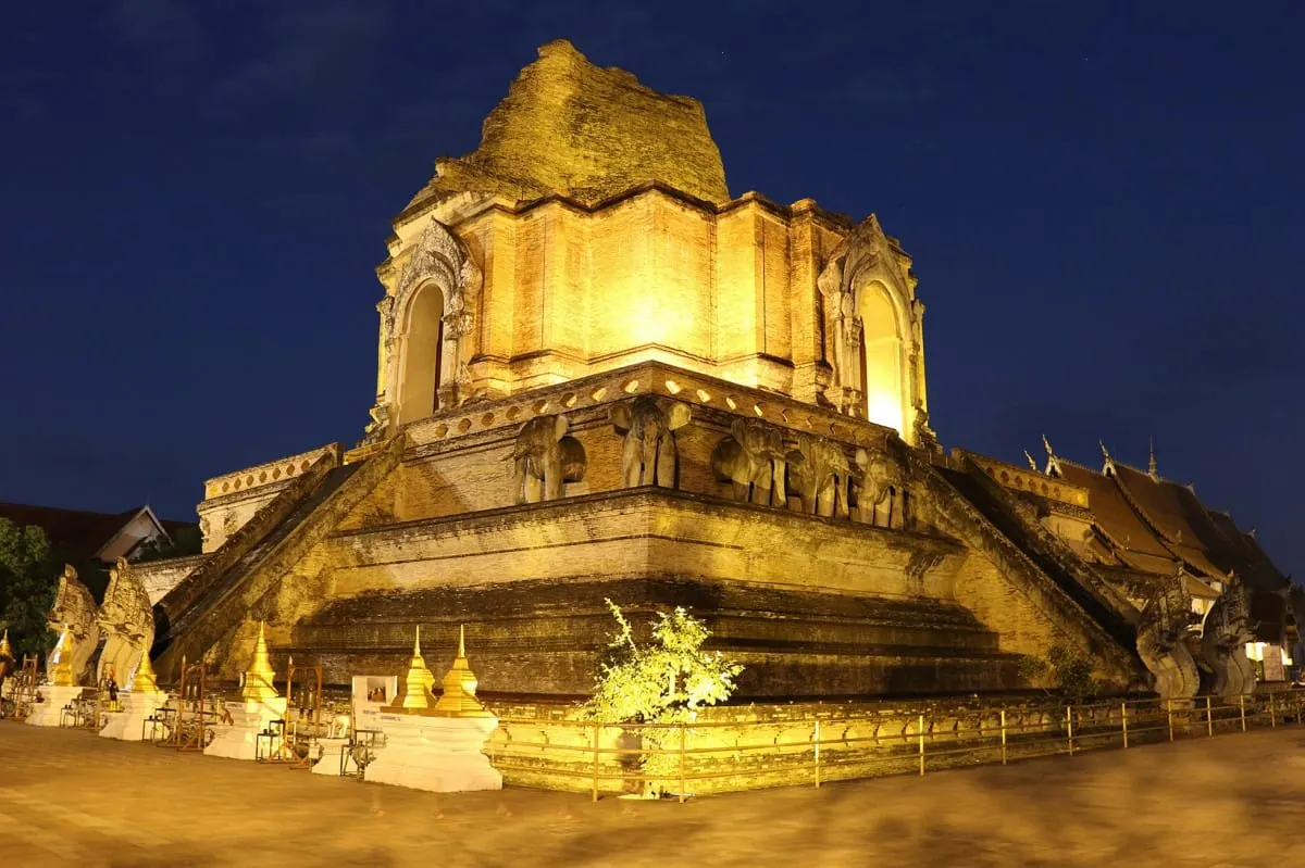 The ruined chedi of Wat Chedi Luang lit up at night, Chiang Mai.