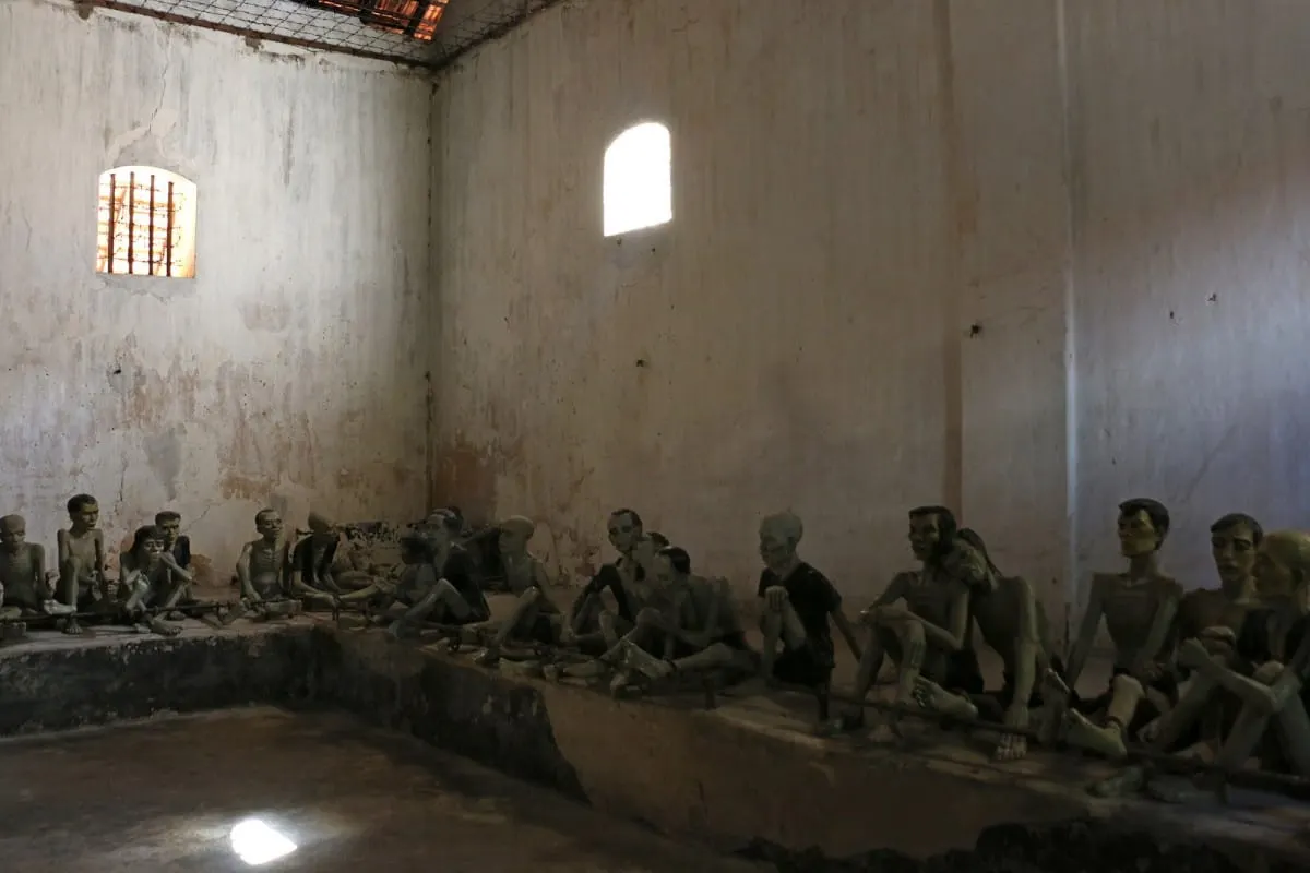 Statues of shackled prisoners in a communal holding cell, Con Dao prison